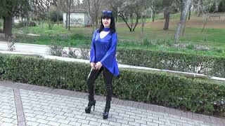 Victoria Devil.elegant Shiny Black Latex Leggings, Metallic Blue Blouse, High-Heeled Ankle Boots.