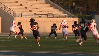 Carson Ouellette hurdles defender