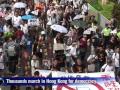 Thousands march on Hong Kong handover anniversary