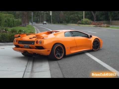 BrianZuk records an insane orange Lamborghini Diablo 60 with black wheels