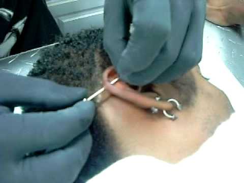 This is me getting my industrial piercing at this tattoo parlor called Steel 