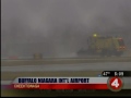 Crews squeegee airport runway