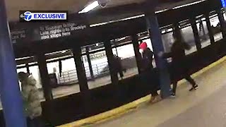 Terrifying  shows woman shoved into moving subway train