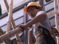 Hong Kong's 'spiders' stick to bamboo scaffolding