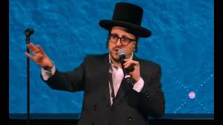 Lipa Schmeltzer Making An Announcement About A New Music Album At ATime Shasaton Event.