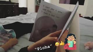 Karina reading a book to her sister Katiusha