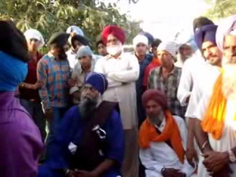 Turban Coach Manjeet Singh Ferozpuria tying turban with closed...