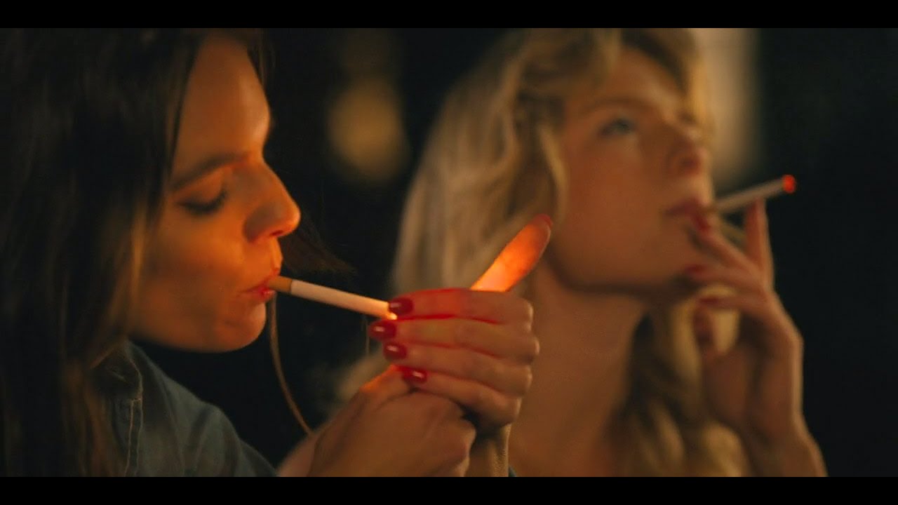 Caitlin Stasey smoking a cigarette (or weed)
