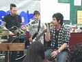 Adam Lambert sings with students