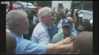 George Bush Shakes Hands Of Haitians, And Wipes Hands On Clinton's Shirt