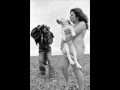 naked woman holding a dog