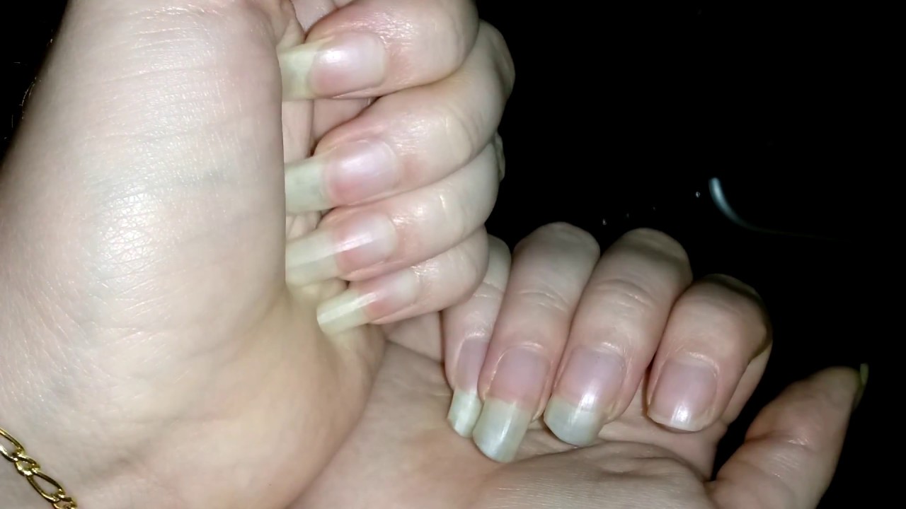 Back scratching with long pink nails