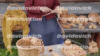 Traditions Of Ancient Karelia. The Woman Weaves Baskets And Things From The Bark Of A Tree.