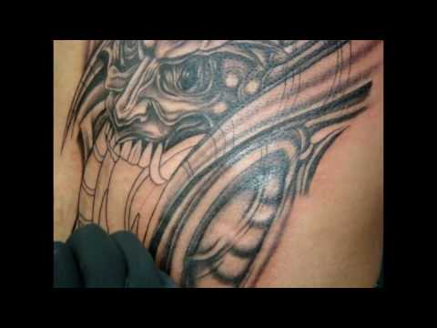 Alex Alien tattooing at Aztec Roots Tattoos Bio-demon p[]