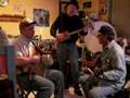 . Knotlenny on the ultra primitive 3-String Cigar Box Guitar - (played through a 1951 Stromberg-Carlson Amplifier.) Capt. Mudflap on his creation