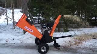 Tow behind wood chipper in action Iron Baltic