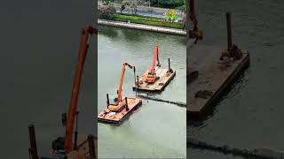 Marine Construction In Action Dredging And Pile Driving In Waterway Projects