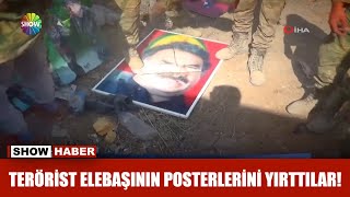 Terörist elebaşının posterlerini böyle yırttılar!