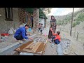 rural life . Babak paints the doors and windows of the kitchen and bathroom