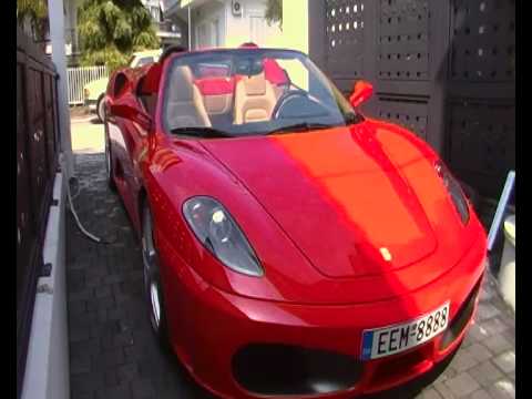 You see a red Ferrari F430 Spider F1 which is cabrio