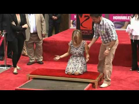 Jenifer Aniston gets her hands and feet printed in cement at the Grauman's