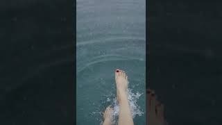 Some Beautiful Feet In Rain. Playing. Footsie.