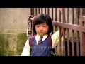 Cute Little Mizo girl stands outside school gate and awaits Mum, Mizoram