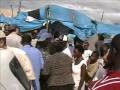 Bringing food to a camp in Haiti - 5-30-2010.wmv