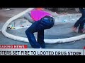 Baltimore rioter destroying firehose