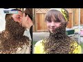 20 PEOPLE COVERED IN BEES