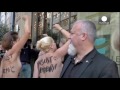Femen hold topless protest outside National Front campaign launch