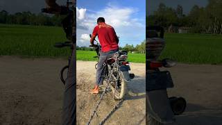 Who Is Tying The Back Of The Motorcycle?
