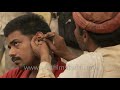 Odd jobs: Traditional Indian road-side ear cleaner