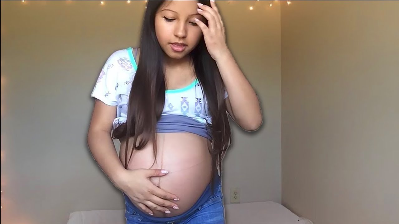 Camgirl pregnant belly movements