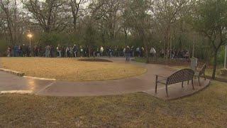 People wait in line to visit President Bush's grave site in College Station