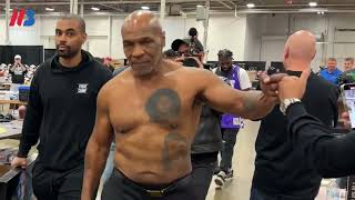 Shirtless Mike Tyson greets fans at sports show ahead of Jake Paul fight