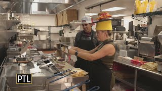 Heather makes a Primanti sandwich in the Primanti Bros kitchen