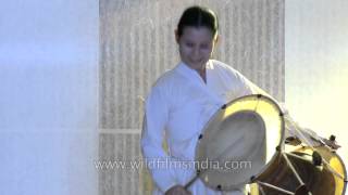 Korean woman performs Samulnori drumming