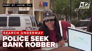 Active scene following a bank robbery at PNC, woman on the run