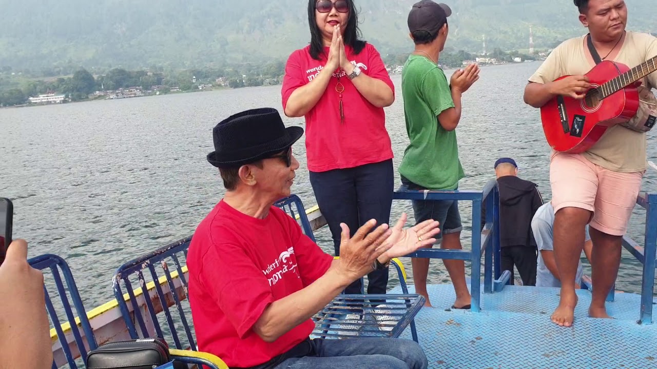Live singer on boat , journey from parapat to ambarita, samosir island
