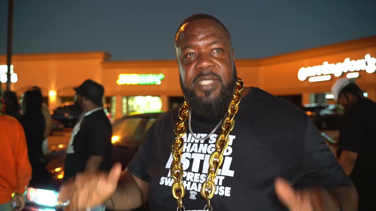 MICHAEL WATTS GIVES QUIET MONEY DOT HIS FLOWERS