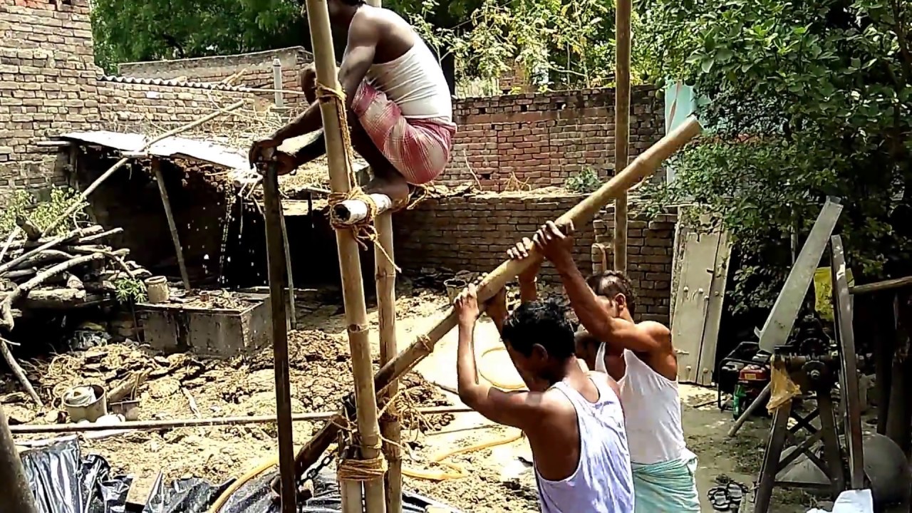 Borewell drilling manually by hand in India's village