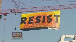 Protesters Climb D.C. Crane, Unfurl Huge ‘RESIST’ Banner