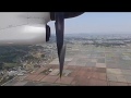 rare view of Bombardier Q400 propeller reverse pitch on landing