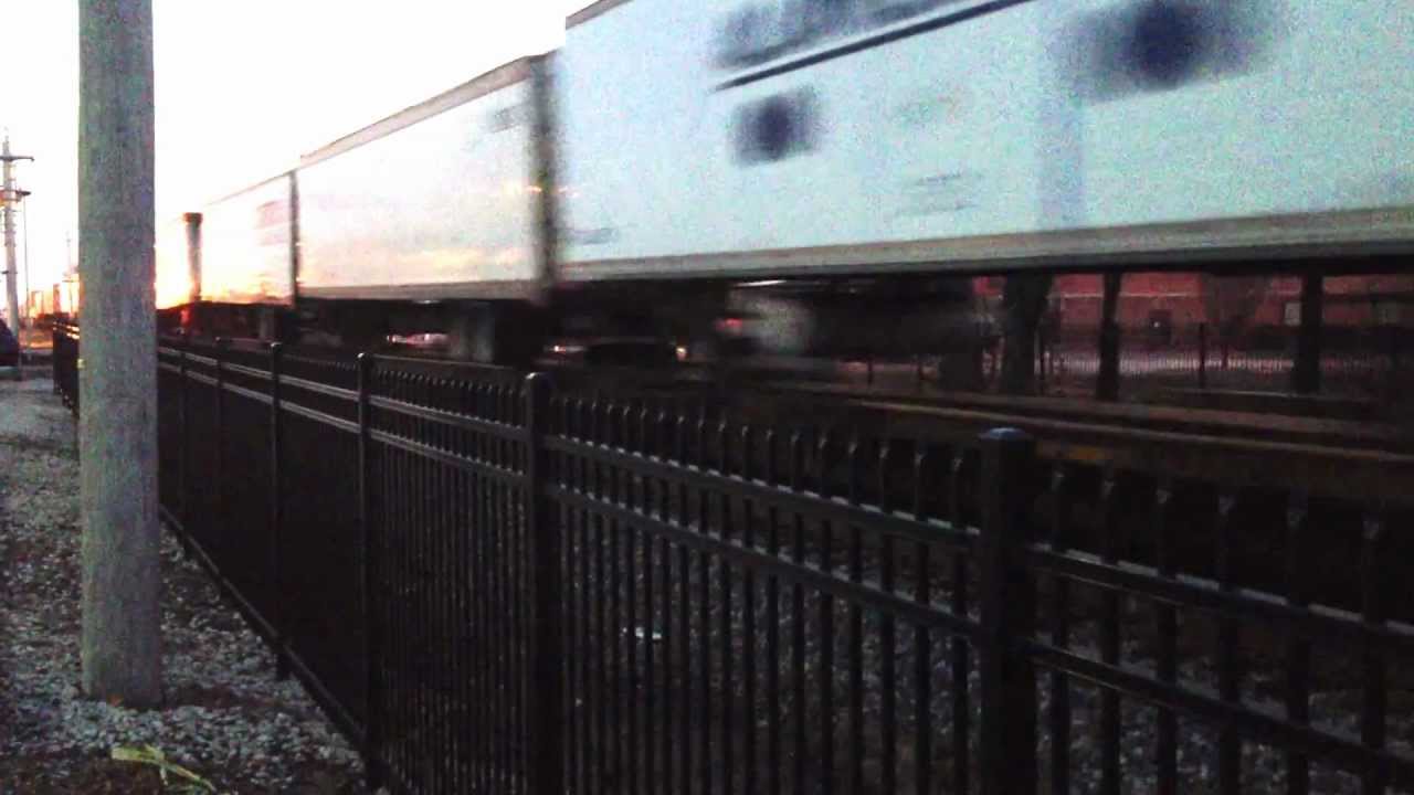 Very fast BNSF stack/tofc train roaring thru Olathe at night.