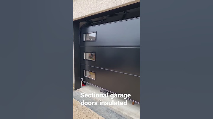 sectional garage doors. windows. Black smooth panels ,Optimum Doors LTD