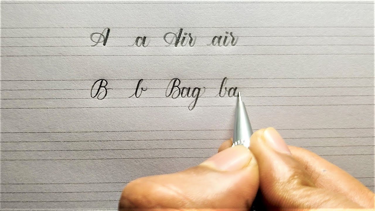 Writing alphabets a z and words in cursive writing cursive