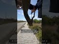 Ukrainian soldier destroys Russian FPV drone on a road