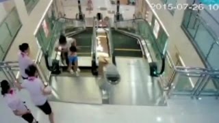 Man watches wife die in China escalator accident