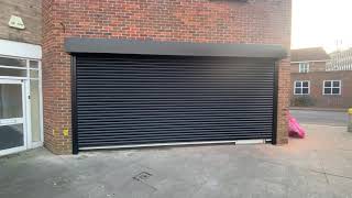 Black steel shop front roller shutter